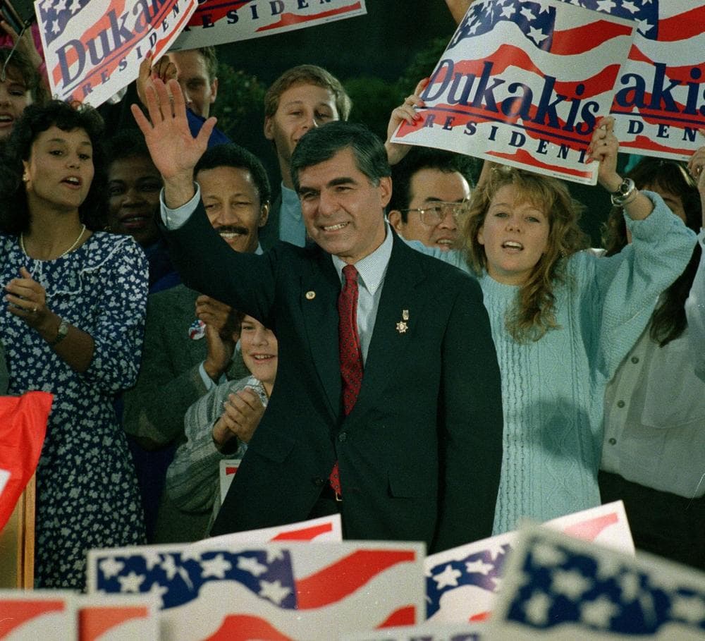 During his campaign for president, Gov. Dukakis waves to supporters at a rally in Los Angeles, Ca., Oct. 15, 1988. (Doug Mills/AP)