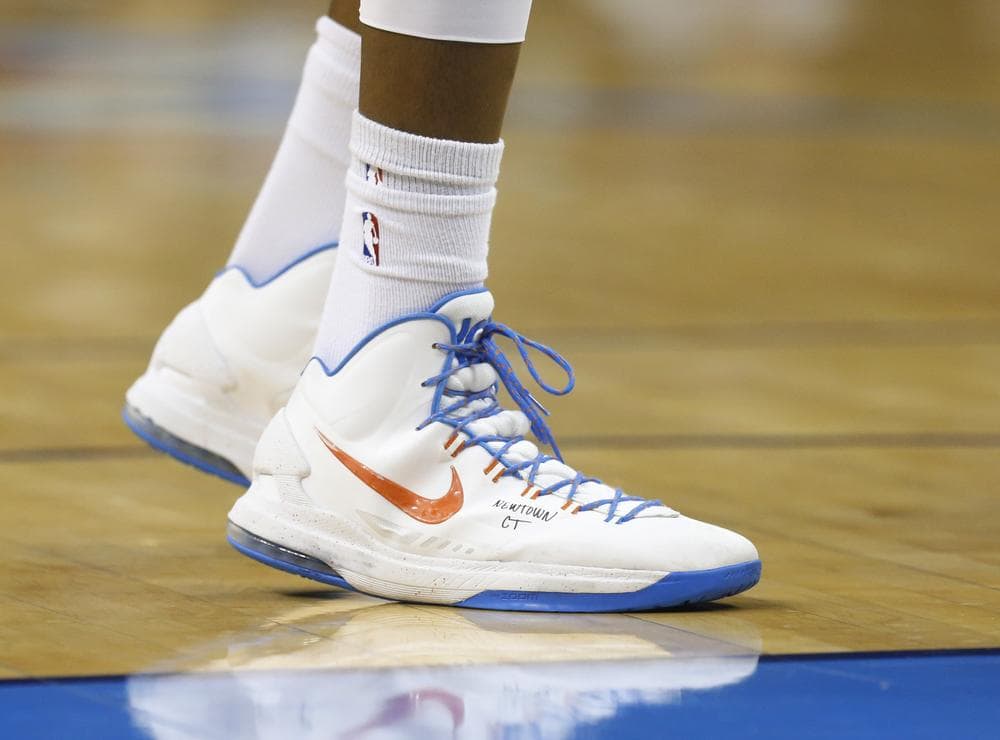 Oklahoma City Thunder star Kevin Durant acknowledged the Newton, Conn. shootings with a message on his sneaker during a game Monday night. (Sue Ogrocki/AP)
