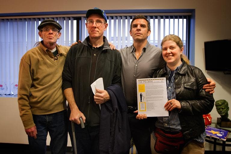 From left, Pilgrim contributors David &quot;Shaggy&quot; Hurley and Kevin Walker, Pilgrim editor James Parker and Pilgrim contributor Margaret Miranda, holding a copy of the literary magazine. (Jesse Costa/WBUR)