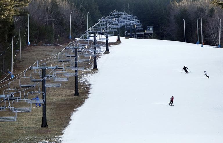 A new study is questioning whether climate trends could put many New England ski resorts out of business for good. Here, in January 2012, man-made snow coats a ski run at Shawnee Peak, but barren ground remains. (Robert F. Bukaty/AP)