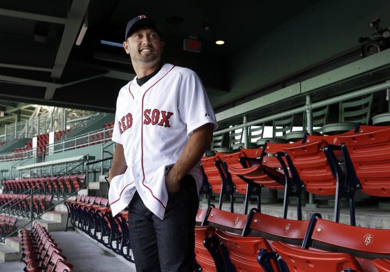 Boston Red Sox new outfielder Shane Victorino poses for photographers at Fenway Park after an introductory baseball news conference in Boston, Thursday, Dec. 13, 2012. (Elise Amendola/AP)