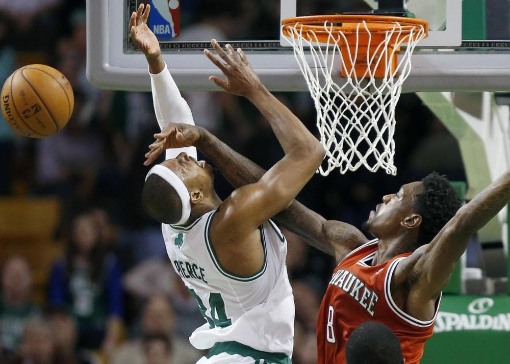 Milwaukee Bucks' Larry Sanders (8) blocks a shot by Boston Celtics' Paul Pierce (34) in the fourth quarter of an NBA basketball game in Boston, Friday, Dec. 21, 2012. (Michael Dwyer/AP)