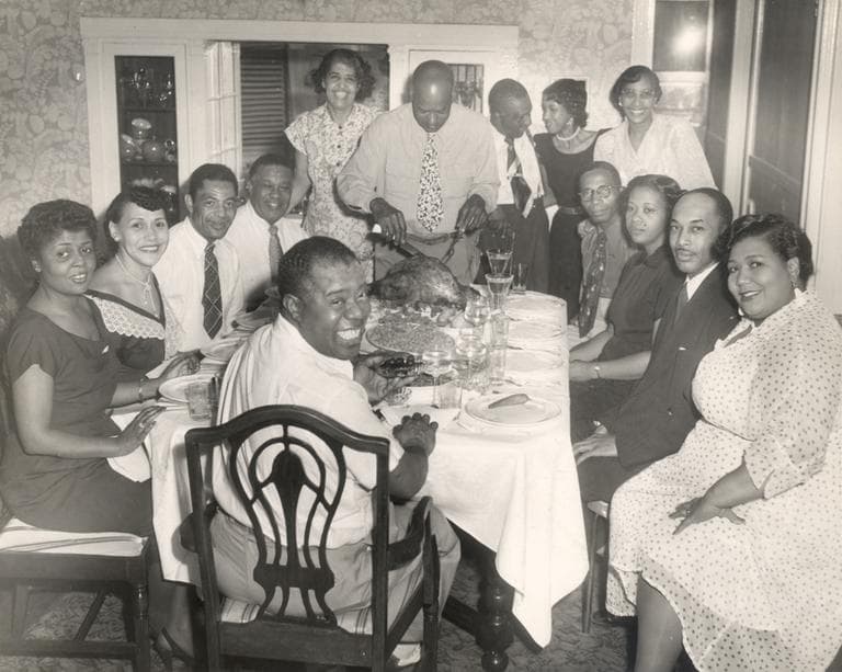 A holiday dinner with Louis Armstrong (front center) and family, circa 1940s. (Louis Armstrong House)