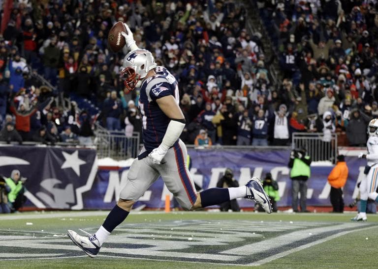 New England Patriots tight end Rob Gronkowski scores a touchdown during the fourth quarter against the Miami Dolphins on Sunday, Dec. 30, 2012. (Elise Amendola/AP)
