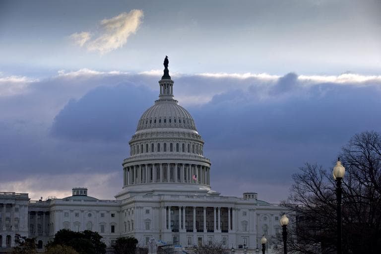 The U.S. Capitol is seen as Congress convenes to negotiate a legislative path to avoid the so-called &quot;fiscal cliff&quot; of automatic tax increases and deep spending cuts that could kick in Jan. 1., 2013.  (AP/J. Scott Applewhite)
