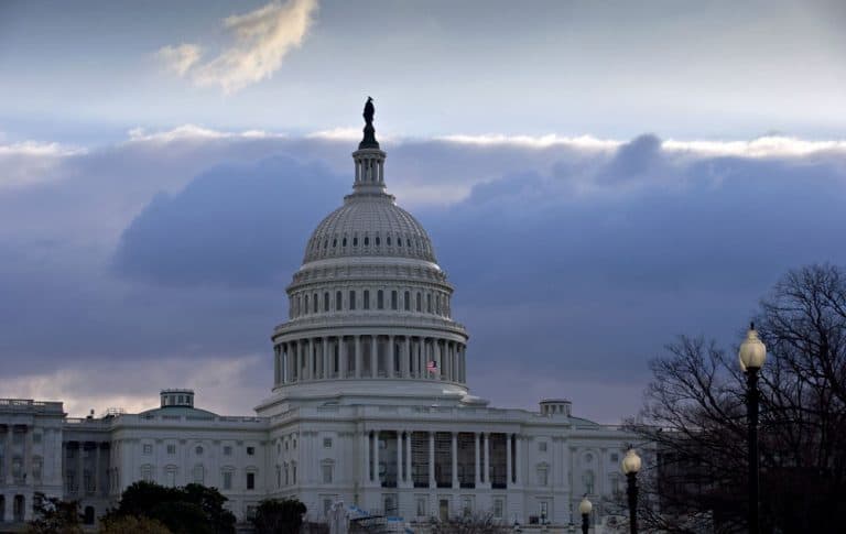 The U.S. Capitol is seen as Congress convenes to negotiate a legislative path to avoid the so-called &quot;fiscal cliff&quot; of automatic tax increases and deep spending cuts that could kick in Jan. 1., 2013.  (AP/J. Scott Applewhite)