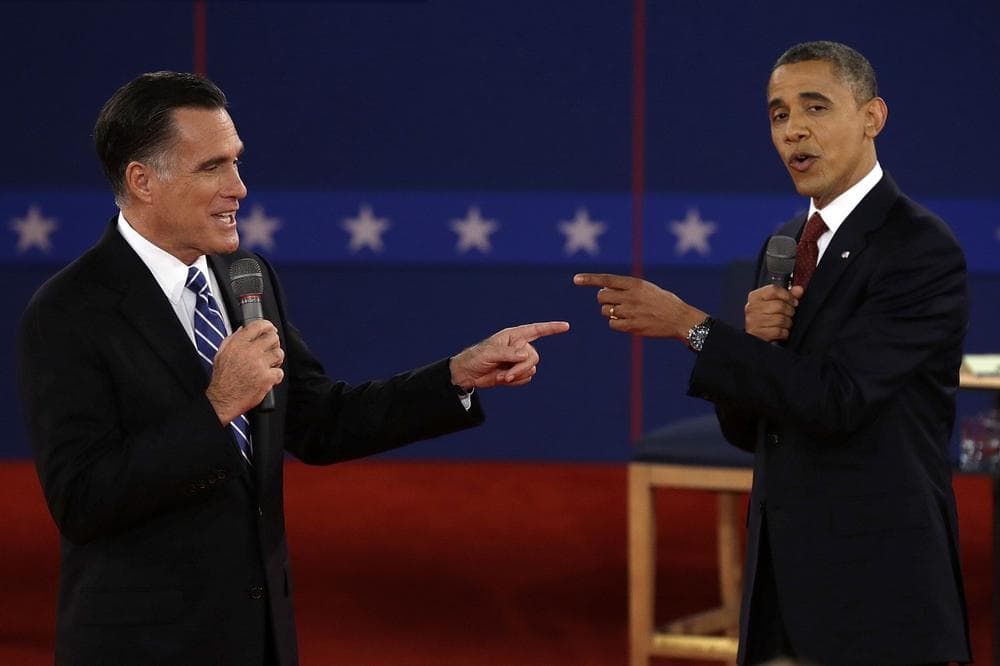 FOR USE AS DESIRED, YEAR END PHOTOS - FILE - In this Oct. 16, 2012 file photo, Republican presidential nominee Mitt Romney, left, and President Barack Obama spar during the second presidential debate at Hofstra University in Hempstead, N.Y. (AP)