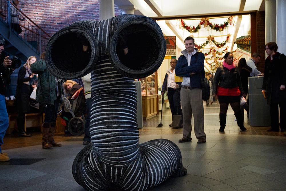 &quot;If you see some of the old photographs … we had nothing to start with. So we went to look for things we would find on the street and recycle them,&quot; Mummenschanz co-founder Floriana Frassetto explained. Above, Frassetto performs at Boston’s Quincy Market. (Jesse Costa/WBUR) 