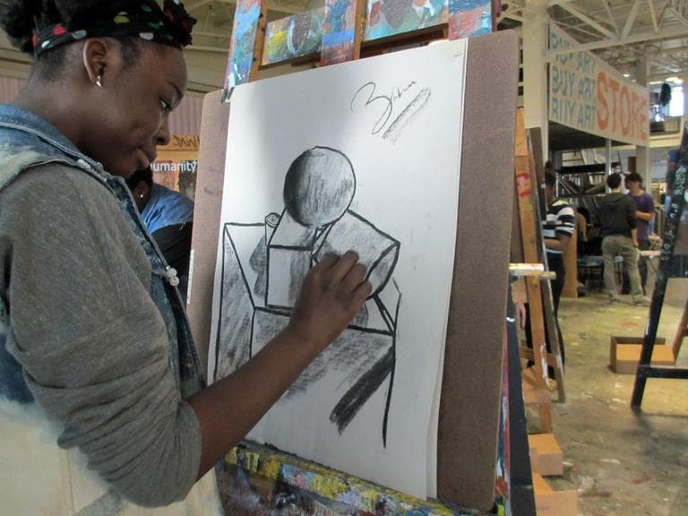 Through apprenticeships, Artists for Humanity employs Boston teenagers to market and sell fine art and design services. Here, a student practices shading techniques in the painting studios. (Kathleen McNerney/WBUR)
