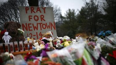 Flowers, candles and stuffed animals make up a makeshift memorial in Newtown, Conn., days after the 2012 shooting. (Reuters/Landov)