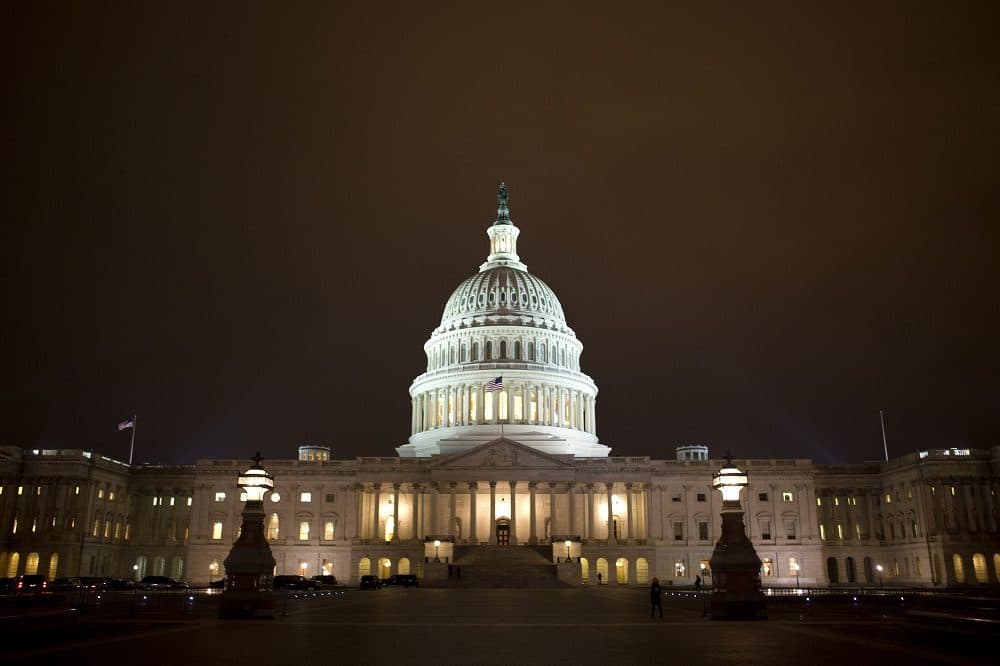 The lights of the U.S. Capitol remain lit into the night as the House continues to work on the &quot;fiscal cliff&quot; on Tuesday, Jan. 1, 2013. (AP/Jacquelyn Martin)