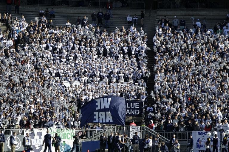 The Penn State Blue Band is surrounded by students at Beaver Stadium on Nov. 17, 2012. (AP/Gene J. Puskar)