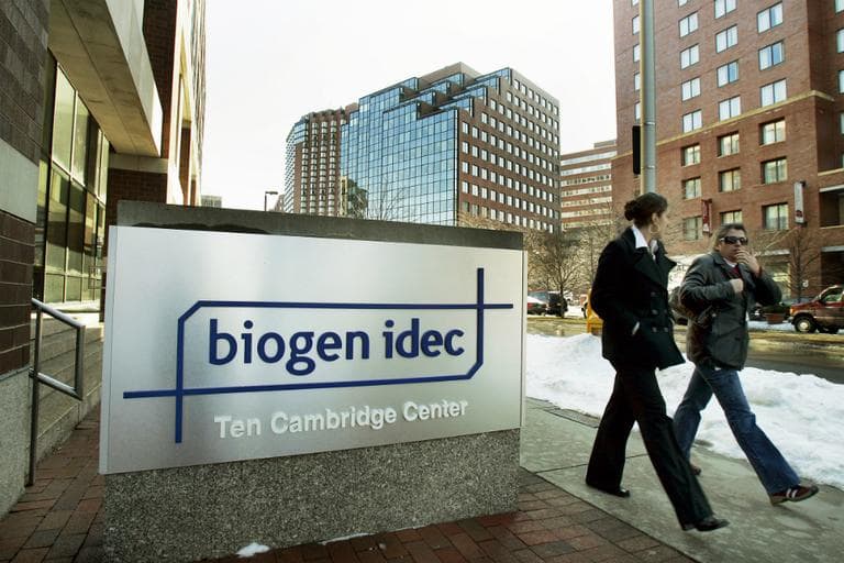 Two women walk by Biogen Idec corporate headquarters in Cambridge, Mass. in this Feb. 15, 2006 file photo. (Elise Amendola/AP File)