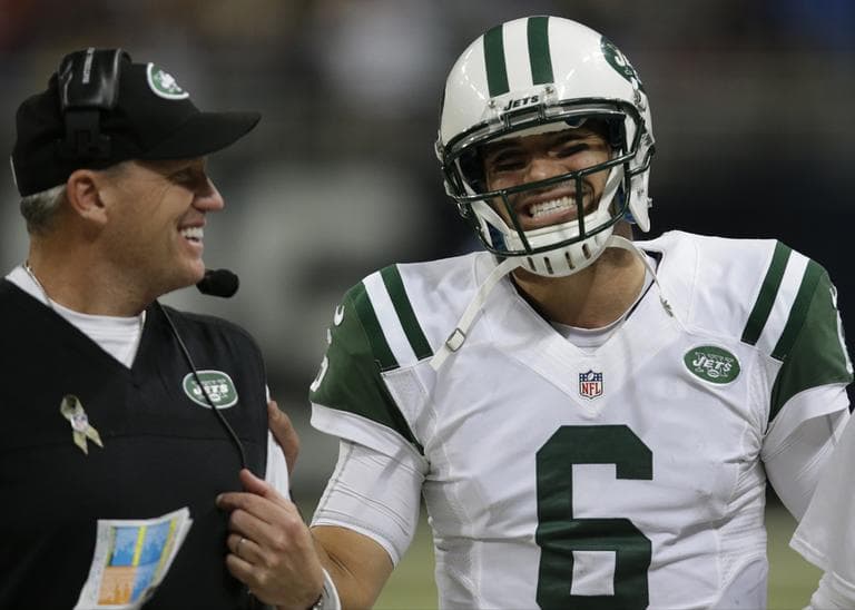 New York Jets coach Rex Ryan (left) reportedly has a new tattoo featuring a woman wearing quarterback Mark Sanchez's jersey. (Tom Gannam/AP)