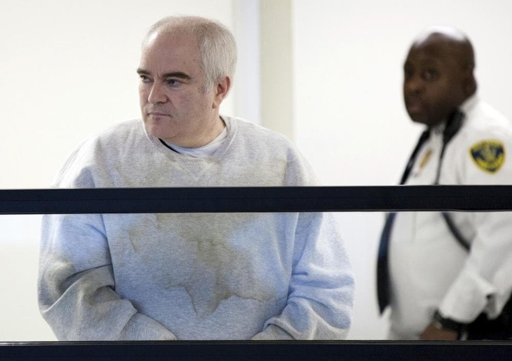 John Burbine, left, is brought in for arraignment at Middlesex Superior Court in Woburn, Mass., Wednesday, Dec. 12, 2012. (Charlie Mahoney/AP)