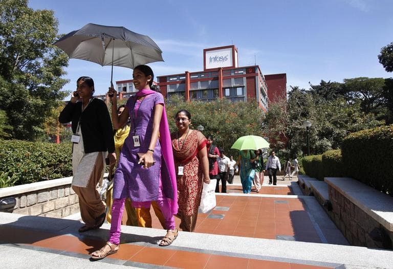 Infosys Technologies employees break for lunch at company's headquarters in Bangalore, India in January 2011. The outsourcing giant is now hiring American workers. (AP Photo/Aijaz Rahi)