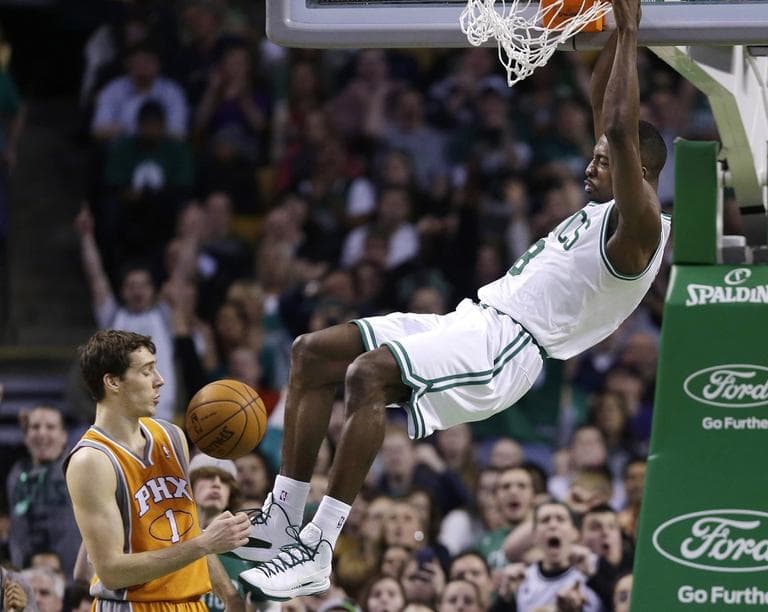 Celtics power forward Jeff Green dunks against Phoenix Suns point guard Goran Dragic  on Wednesday. (AP/Elise Amendola)