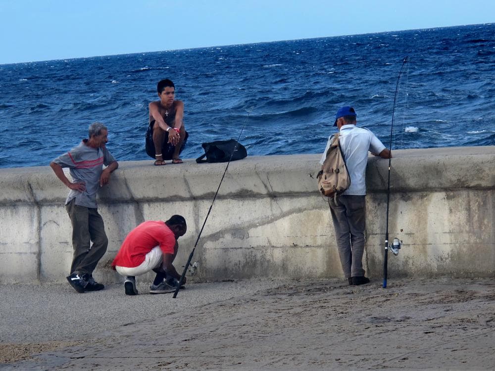 Fishermen, young and old, along the Malecon, Cuba's famous waterfront roadway.