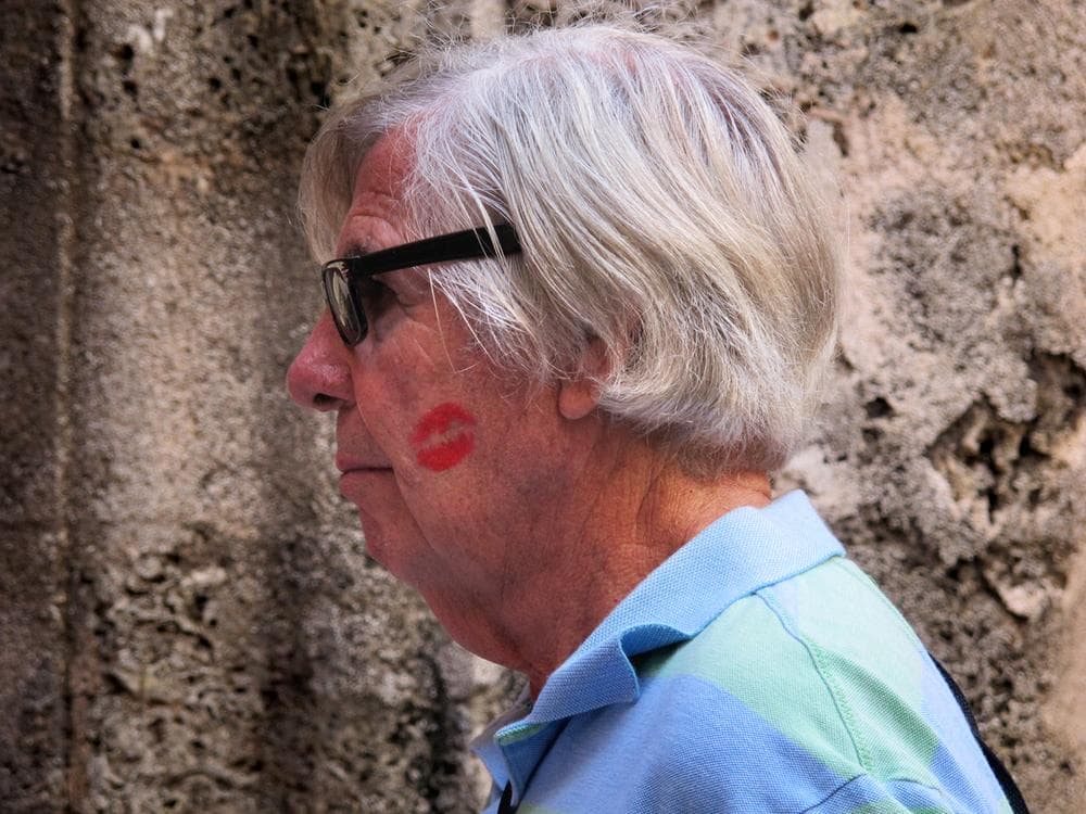 American art collector Tom Licciardi bought a big, red kiss from Cuban women in Havana's San Francisco Square. Cubans have licenses to sell many things to tourists, including smooches.