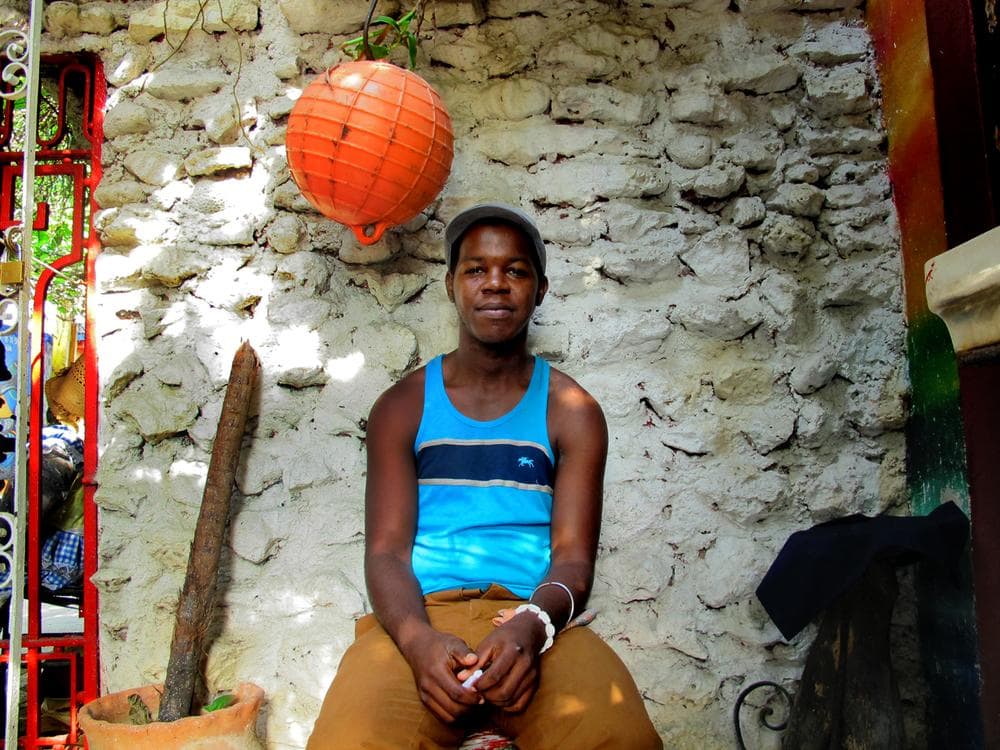 A young Cuban man graciously sits for a photo in the Callejon de Humel, a popular public art project in Havana.