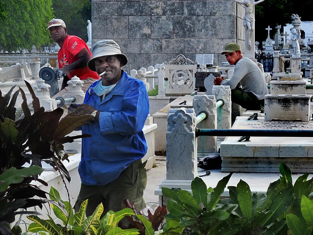Workers employed by the Cuban government keep the tombstones in the historic Colon Cemetery pristine.