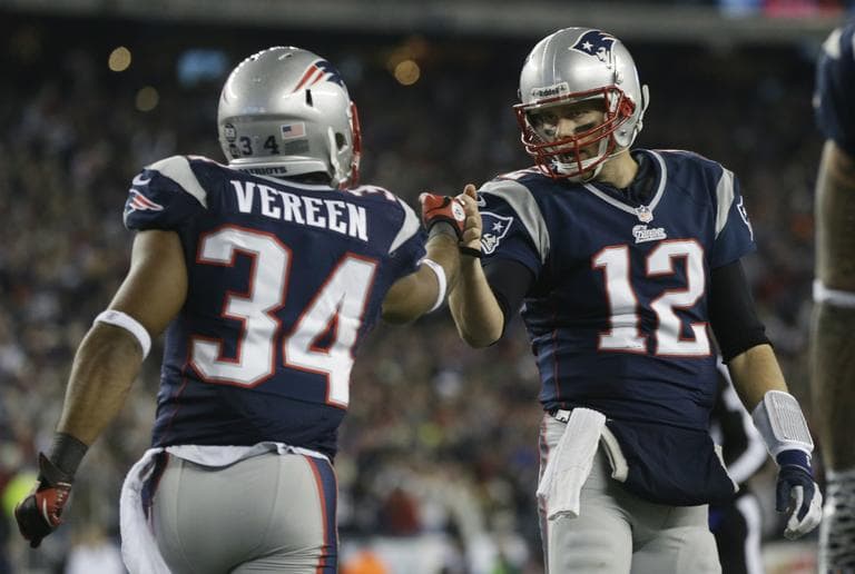 New England Patriots running back Shane Vereen, left, is congratulated by quarterback Tom Brady after Vareen's eight-yard touchdown pass reception from Brady during the first half of an AFC divisional playoff NFL football game in Foxborough, Mass., Sunday, Jan. 13, 2013. (Elise Amendola/AP)