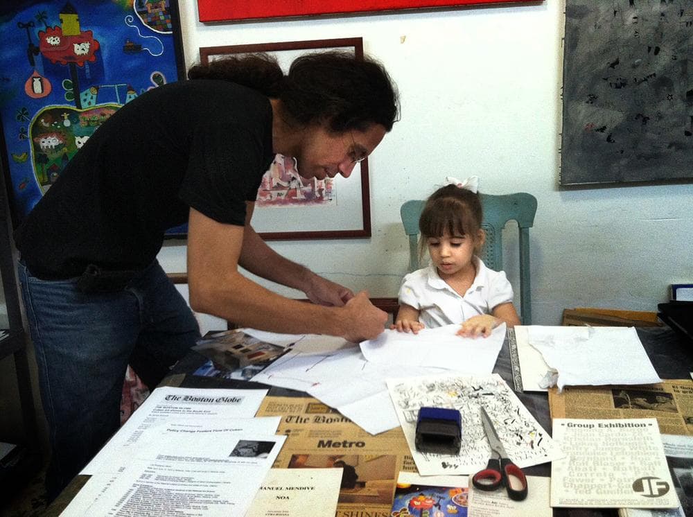 Luis Rodriguez with his daughter, Cecilia. (Andrea Shea/WBUR)
