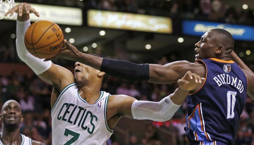 Bobcats forward Bismack Biyombo tries to grab a rebound against Celtics forward Jared Sullinger during the second half of Monday night's game in Boston. The Celtics won 100-89. (Charles Krupa/AP)