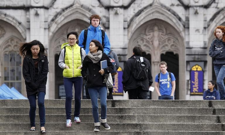 University of Washington students walk on the campus between classes in October 2012, in Seattle. (Elaine Thompson/AP)
