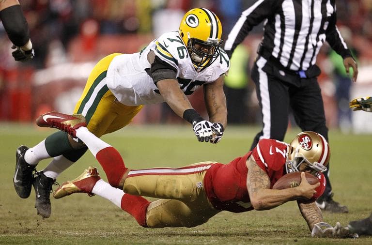 Green Bay Packers defensive end Mike Daniels (76) dives at San Francisco 49ers quarterback Colin Kaepernick (7) during an NFC divisional playoff NFL football game in San Francisco on Saturday. (Tony Avelar/AP)
