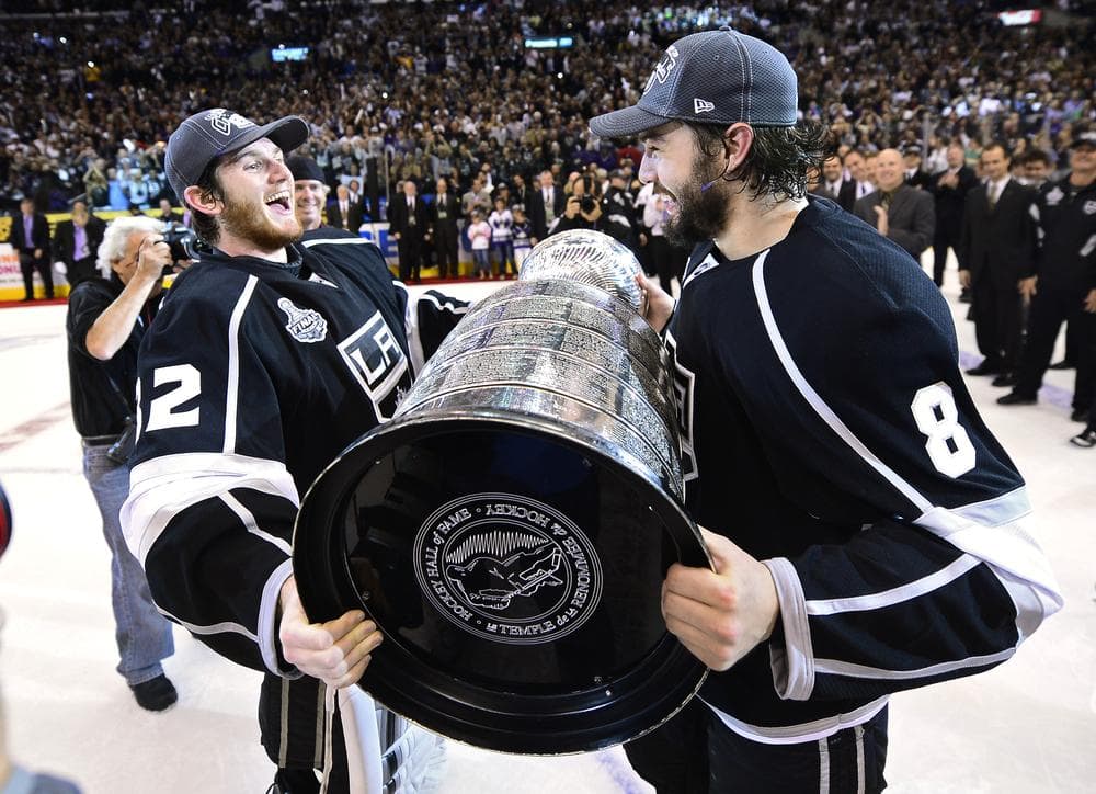 Winning one Stanley Cup was difficult enough, but repeating as NHL champs will be even harder for goalie Jonathan Quick, left, defenseman Drew Doughty, and the Los Angeles Kings (Mark Terrill/AP)