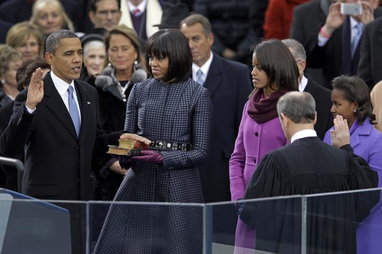 President Barack Obama receives the oath of office from Chief Justice John Roberts as first lady Michelle Obamas and his daughters Malia and Sasha look on at the ceremonial swearing-in at the U.S. Capitol during the 57th Presidential Inauguration in Washington on Monday. (Carolyn Kaster/AP)