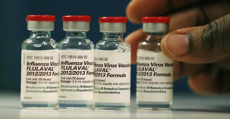 Vials of flu vaccine are displayed at the Whittier Street Health Center in Boston, Mass., in January 2013. (Charles Krupa/AP)