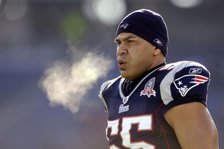 Junior Seau warms up on the field before an NFL wild-card playoff football game in Foxborough, Mass in 2010. (Charles Krupa/AP)