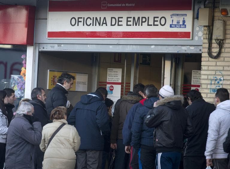 People queue to enter an unemployment registry office in Madrid, on Thursday Jan. 24, 2013. Spain’s unemployment rate shot up to a record 26.02 percent in the fourth quarter of 2012, leaving almost million people now out of work. (Paul White/AP)