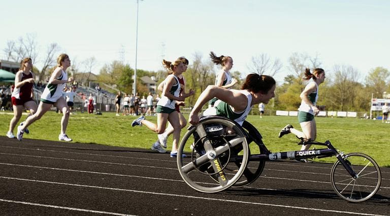 Wheelchair athlete Tatyana McFadden, front, races in her first track meet along side able-bodied high school runners in April 2006 in Rockville, Md. Tatyana McFadden, then a sophomore at Atholton High School, sued the county school system in federal court in Baltimore for the right to race at the same time as able-bodied athletes. She had been forced to compete in separate wheelchair events, usually by herself. (Chris Gardner/AP)