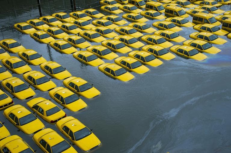 A parking lot full of yellow cabs is flooded as a result of superstorm Sandy on Tuesday, Oct. 30, 2012 in Hoboken, NJ. (AP)