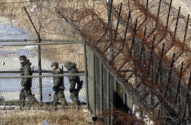 South Korean army soldiers patrol along the barbed-wire fence at the Imjingak Pavilion, South Korea, near the demilitarized zone (DMZ) of Panmunjom on Saturday. (Ahn Young-joon/AP)