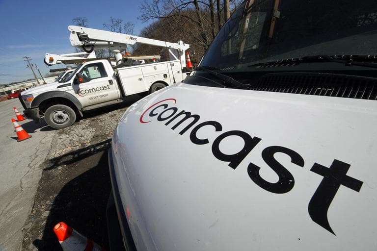  Comcast logos are displayed on installation trucks in Pittsburgh. (AP)
