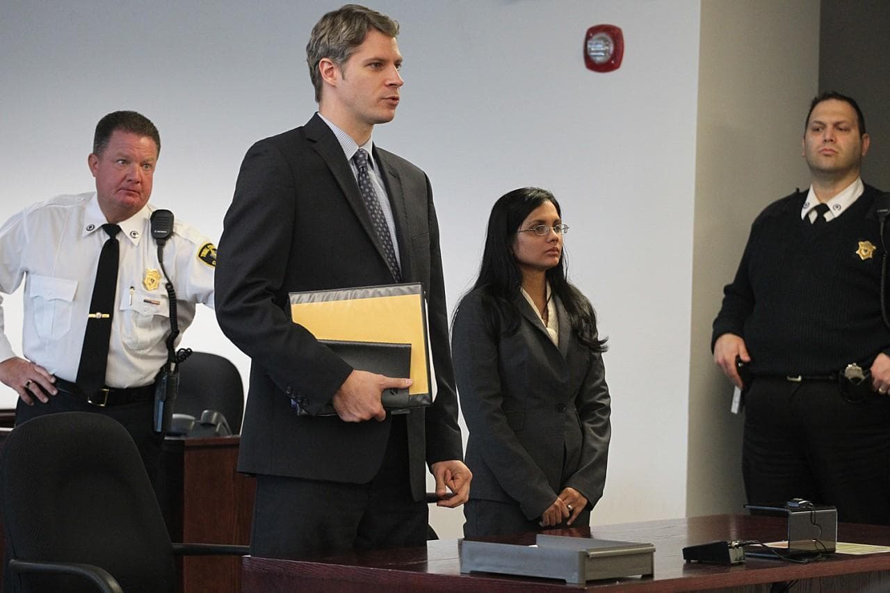 Former state lab chemist Annie Dookhan, second from right, stands in Middlesex Superior Court for arraignment on Wednesday, Jan. 9, 2013, with her attorney Nick Gordon, second left, in Woburn, Mass. Dookhan pleaded not guilty to three counts of obstruction of justice. She is charged in connection with altering drug evidence during the testing process and obstructing justice. Prosecutors allege Dookhan fabricated test results and tampered with drug evidence while testing substances in criminal cases. (AP)