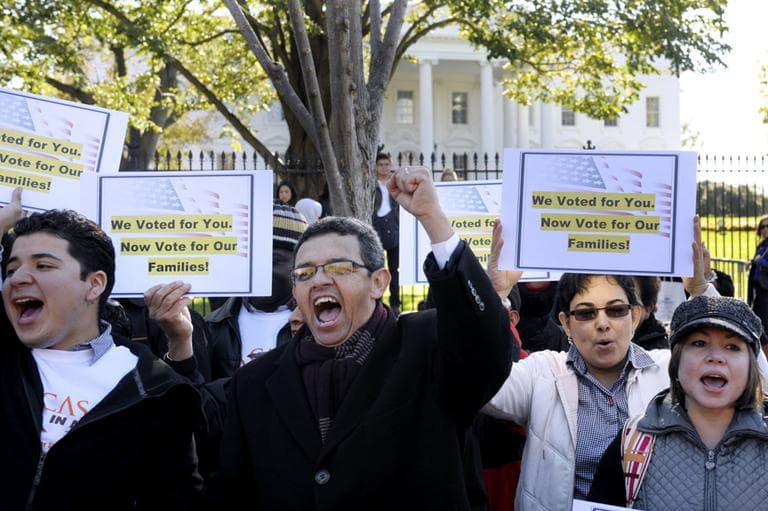 Gustavo Torres, director, Casa in Action, center, and others, chant during a rally of immigration rights organizations, including Casa in Action and Maryland Dream Act, in front of the White House in Washington, Thursday, Nov. 8, 2012. (AP)