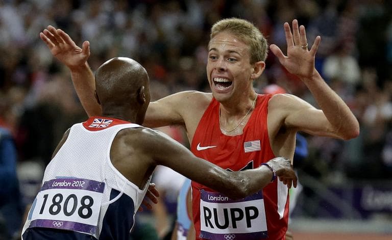 Galen Rupp reacts with Mo Farah after the men's 10,000-meter run during the 2012 Summer Olympics in London. (Rebecca Blackwell/AP)