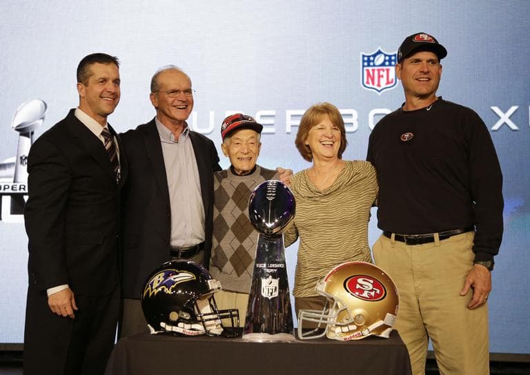 San Francisco 49ers head coach Jim Harbaugh (left) and Baltimore Ravens head coach John Harbaugh (right) pose with parents Jack and Jackie and grandfather Joe Cipiti during a news conference on Friday for the NFL Super Bowl XLVII football game. (Matt Slocum/AP)
