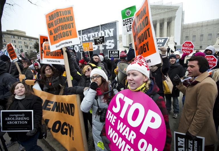 Demonstrators both for and against abortion rights protest in front of the U.S. Supreme Court in Washington, Friday, Jan. 25, 2013. (Manuel Balce Ceneta/AP)