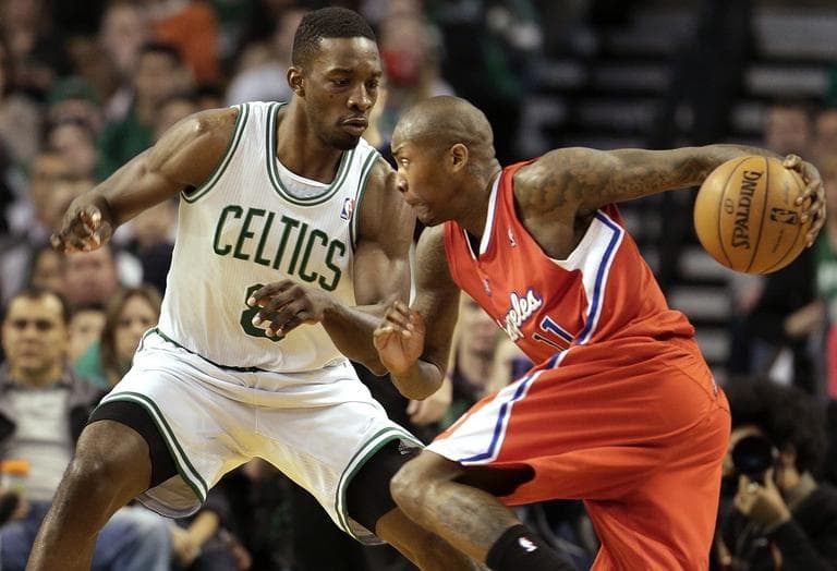 Celtics forward Jeff Green (8), left, tries to block Los Angeles Clippers shooting guard Jamal Crawford (11). (AP/Steven Senne)