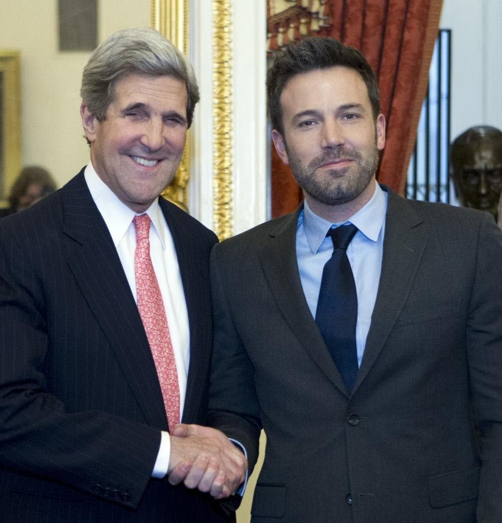 U.S. Sec. of State and then-Sen. John Kerry shakes hands with Affleck  in Washington on Wednesday, Dec. 19, 2012. (Jose Luis Magana/AP)