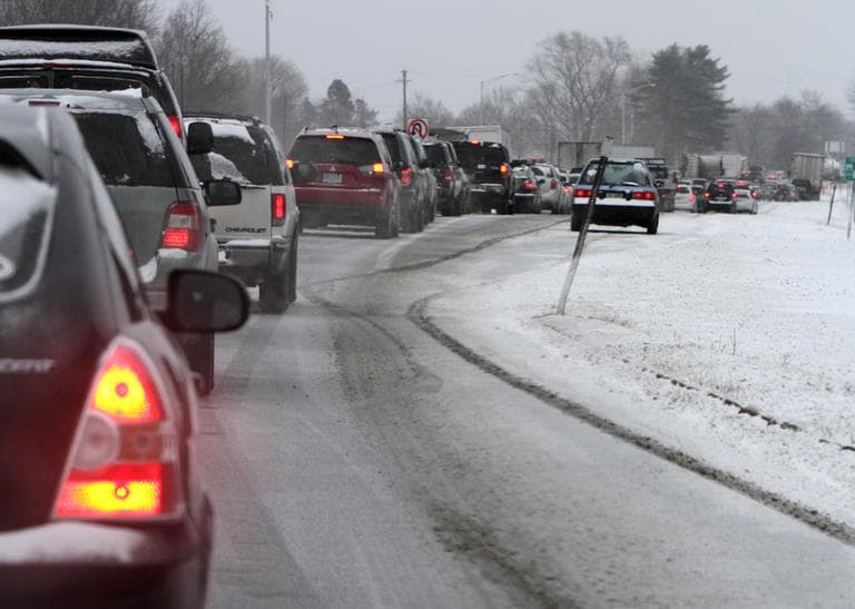 Cars are stuck in traffic as a winter storm arrives, Friday, Feb. 8, 2013 in Newington, N.H. Snow began to fall around the Northeast on Friday at the start of what's predicted to be a massive, possibly historic blizzard. (Jim Cole/AP)