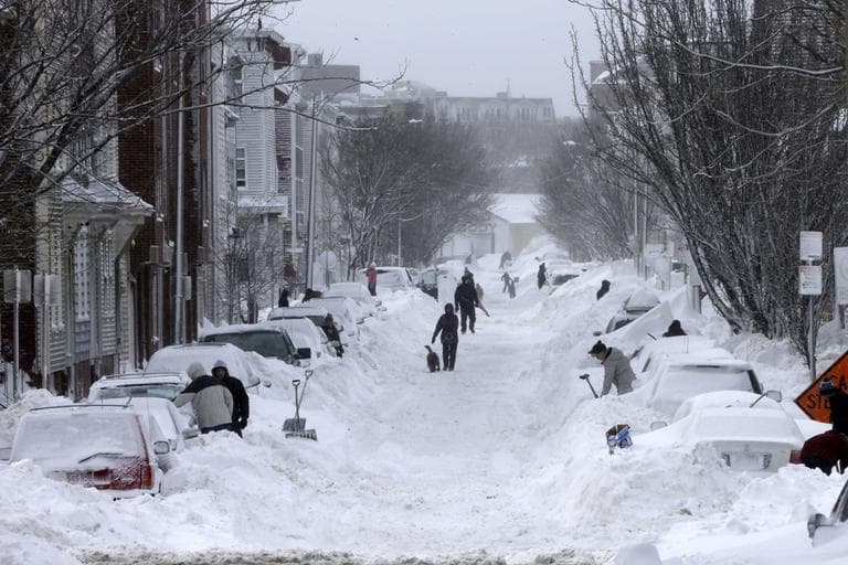 Residents on Second street in South Boston begin shoveling out their cars on Saturday. (Gene J. Puskar/AP)