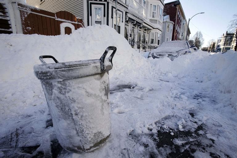 A trash can marks the cleared out parking spot of a resident on M street in the South Boston early Sunday, Feb. 10, 2013. (Gene J. Puskar/AP)