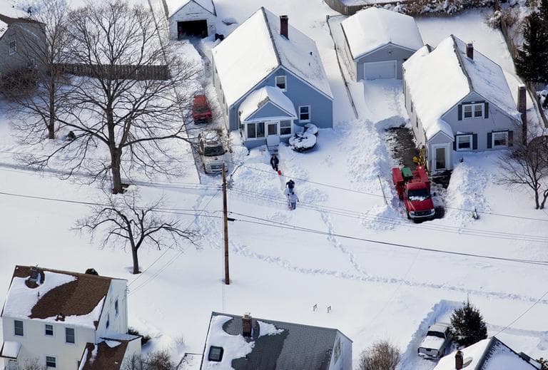 People dig out in front of a snow covered home near Hamden, Conn., Sunday, Feb. 10, 2013, in the aftermath of a storm that hit Connecticut and much of the New England states. (Craig Ruttle/AP)